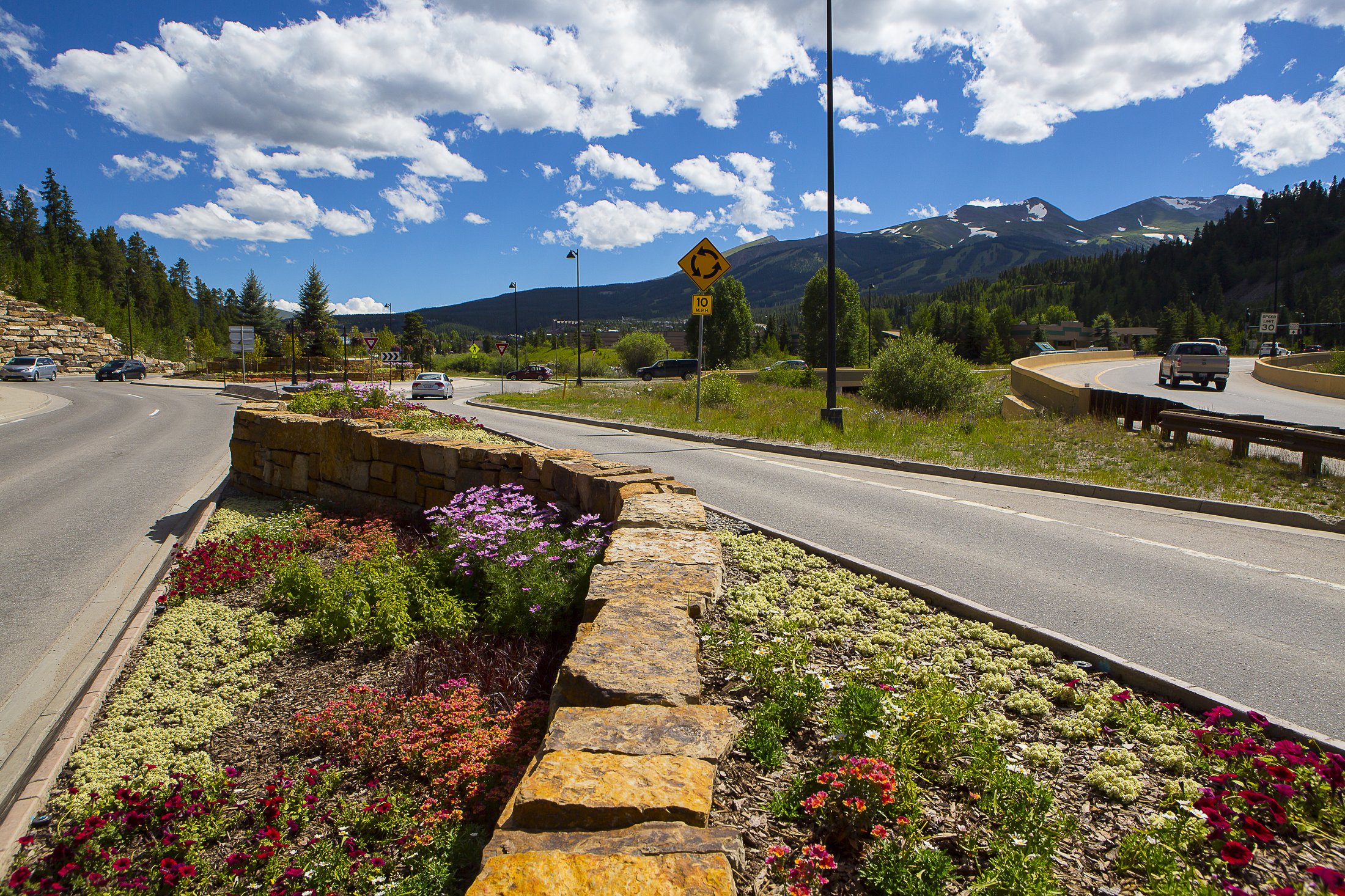 Hand-stacked stone wall with flowers in Breckenridge